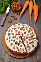Carrot cake on wooden background
