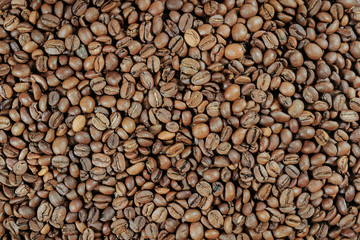 Roasted coffee beans, background, coffee texture. Top view.