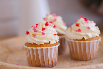 cupcake with pink hearts eatable decor close up
