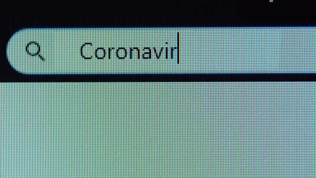 Browser tab with Coronavirus Cases text typed on the computer monitor. Shot in 4k resolution