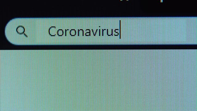 Browser tab with Coronavirus recession text typed on the computer monitor. Shot in 4k resolution