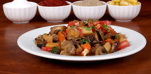 perfect turkish food vegetable kebab spicy on white plate close up on wooden table