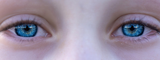 The blue eyes of the child. Photographed close-up.