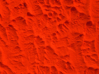 Solid red color plaster concrete wall texture background.