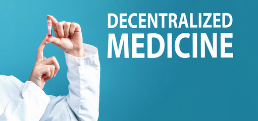 Decentralized Medicine theme with a doctor holding a laboratory vial on a blue background