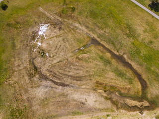 Aerial view of calm and tranquil bog in wetland in Switzerland.