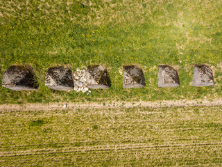 Aerial view of old tank barrier in Switzerland. Massive stones serving as obstacles against tanks in overhead view. Concept of world war 2 defense.