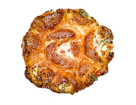 Romanian traditional sweat course for easter, "Pasca" with cheese , Sesame seeds and Turkish delight, isolated on white background, top view.