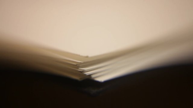 Macro closeup of papers piling on to each other blank surreal