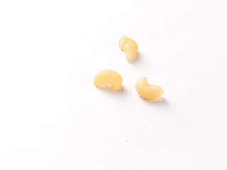 Uncooked macaroni elbow shape pasta with white background stock image. 