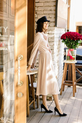 Portrait of young gorgeous blonde caucasian sexy girl outdoors in summer in the european streets walking in fashionable stylish dress