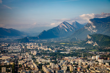 Aerial view with grand mountains edging the city of Grenoble France