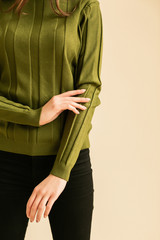 Fashion portrait of young happy smiling lady wearing trendy beige turtleneck, high-waisted checkered trousers