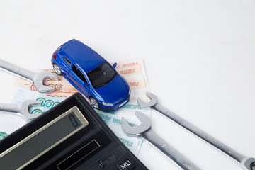 Concept.Car repair. Save money on car repairs.The calculation of the budget.