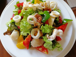 Mixed salad of seafood prawns and fresh vegetables. Delicious and healthy food
