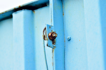 Steel and blue gates and fence on the swamp