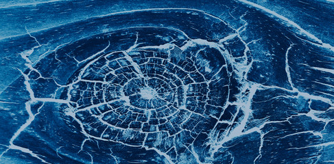 Dark stained blue reclaimed wood surface Rough wooden planks with cracks.