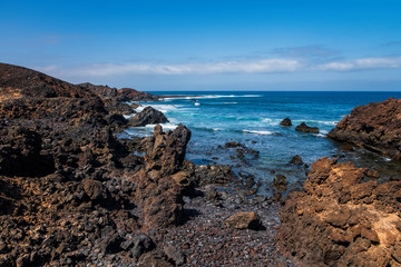 Fototapeta na wymiar Lobos Island, Spain - october 2019. Isla De Lobos Lobos Island a largely unhabited volcanic island off the coast of Corralejo, Fuerteventura