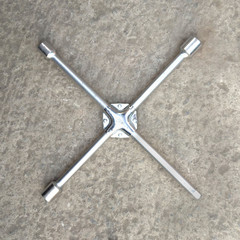 Wheel wrench on concrete background