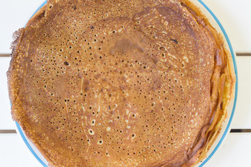 Homemade pancake in plate closeup - 340400390