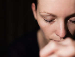 Closeup portrait of woman praying. 