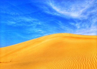 Fototapeta na wymiar sand dunes and blue sky