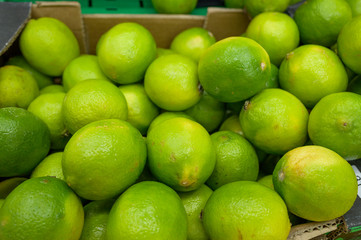 lemon lime on the shelves in the supermarket for customers, citrus