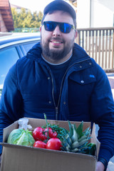 man courier delivering healthy food in disposable paper box