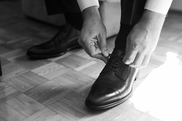 Businessman preparing for business. Suit and fashion