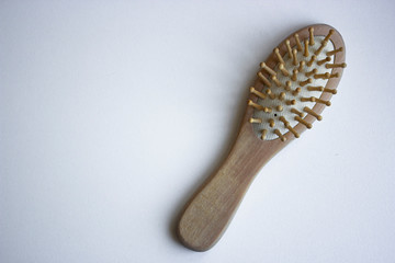Wooden ecofriendly material natural hearbrush on the white background