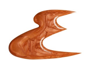 Blot of orange nail polish shaped letter “E” isolated on white