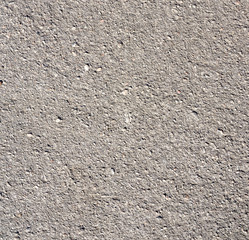 texture of gray cement with cracks and scuffs, full frame