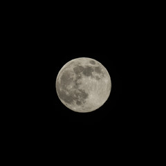 Full moon on dark night sky.