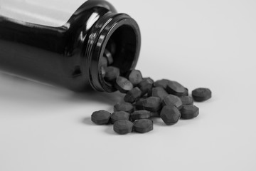 Pills spilling from the bottle.