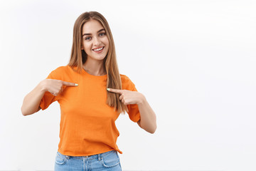 Me is all you need. Portrait of confident good-looking blonde girl pointing herself, smiling...