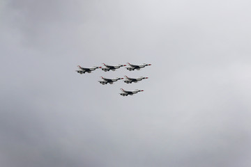 fighter jets flying in perfect formation