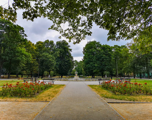Park center in Lodz city with fountain and colorful flowers