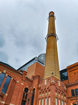 Chimney of renovated brick building in Ł&oacute;dź City at cloudy day