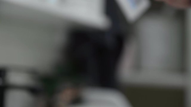 Close up of man puts toothpaste on toothbrush