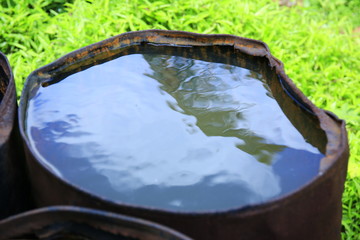 Beautiful sky reflection on water in a barrel