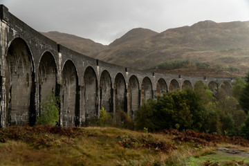Glenfinnan Railway Viaduct in Scotland with, view from the ground during cloudy day