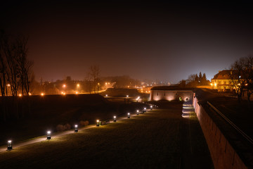 Fototapeta na wymiar Night view of the fortifications of the Zamosc fortress (southeastern Poland). UNESCO World Heritage Site. In the past one of the biggest fortresses of the Polish-Lithuanian Commonwealth.