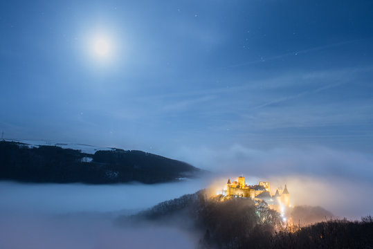Bourscheid castle under a full moon