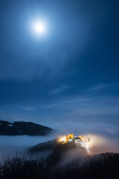 Bourscheid castle under a full moon
