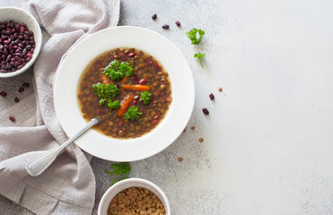 Vegan soup with lentils, red beans and carrots
