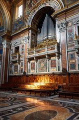 A ray of light shines on the benches in the Basilica di San Giovanni in Laterano, in Rome, Italy.