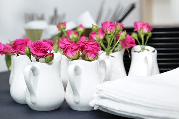 Delicate, expressive rosebuds for table decoration. Preparation for the holiday