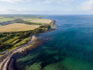 Fototapeta na wymiar Aerial drone photo of a beautiful coast located in the north of Scotland on the North Coast 500 road. Horizontal drone look.