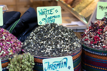 Dried herbal teas close-up. In the round box in front of the store. Healthy and delicious in...