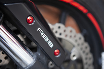 Fototapeta na wymiar Motorcycle brake with abs system macro detail